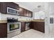 Kitchen boasts granite countertops and dark wood cabinets at 800 9Th Ave. S # T-4, North Myrtle Beach, SC 29582