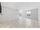 Living room with tile floors, sliding glass doors, and window at 800 9Th Ave. S # T-4, North Myrtle Beach, SC 29582
