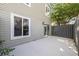 Small patio area with grey fence and siding at 800 9Th Ave. S # T-4, North Myrtle Beach, SC 29582