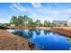 Community pond with reflections of trees and houses at 163 Sago Palm Dr., Myrtle Beach, SC 29579