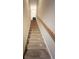 Carpeted staircase with wooden handrail leading to the upper level at 3564 Saint James Ave. # A B, Myrtle Beach, SC 29577