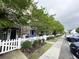 Townhouse with white picket fence and landscaping at 3564 Saint James Ave. # A B, Myrtle Beach, SC 29577