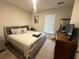 Spacious bedroom with a large bed, dresser, and window coverings at 3564 Saint James Ave. # A B, Myrtle Beach, SC 29577