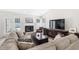 Bright living room with sectional sofa, fireplace, and access to backyard at 723 Antigua Dr., Myrtle Beach, SC 29572