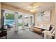 Relaxing sunroom with comfortable seating and pool view at 723 Antigua Dr., Myrtle Beach, SC 29572