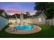 Inviting kidney-shaped pool in the backyard at dusk at 723 Antigua Dr., Myrtle Beach, SC 29572