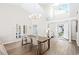 Bright dining area with a long wooden table and access to the living room at 723 Antigua Dr., Myrtle Beach, SC 29572