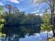 Tranquil river reflecting the sky and surrounding trees at 492 Honeyhill Loop, Conway, SC 29526