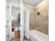 Clean bathroom with a shower/tub combo and tile surround at 619 Springs Ave., Pawleys Island, SC 29585