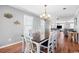 Dining room with table and chairs, open to living room at 619 Springs Ave., Pawleys Island, SC 29585