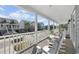Relaxing front porch with rocking chairs and street view at 619 Springs Ave., Pawleys Island, SC 29585