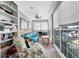 Bright sunroom features built-in shelving and comfortable seating at 619 Springs Ave., Pawleys Island, SC 29585