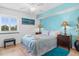 Bedroom with a queen bed, light blue color scheme, and ocean-themed art at 2151 Bridgeview Ct. # 3501, North Myrtle Beach, SC 29582