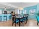 Dining room with dark wood table and teal chairs at 2151 Bridgeview Ct. # 3501, North Myrtle Beach, SC 29582