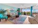 Living room with comfy seating, balcony access, and coastal decor at 2151 Bridgeview Ct. # 3501, North Myrtle Beach, SC 29582