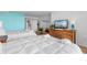 Bedroom with two twin beds, dresser, and view into bathroom at 2151 Bridgeview Ct. # 3501, North Myrtle Beach, SC 29582