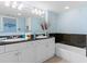 Double vanity bathroom with granite countertop and a bathtub at 2151 Bridgeview Ct. # 3501, North Myrtle Beach, SC 29582