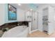 Bathroom with corner bathtub, walk-in shower, and granite vanity at 2151 Bridgeview Ct. # 3501, North Myrtle Beach, SC 29582