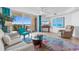 Living room with comfortable seating, balcony access, and water views at 2151 Bridgeview Ct. # 3501, North Myrtle Beach, SC 29582