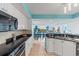 Modern kitchen with white cabinets, granite counters, and stainless steel appliances at 2151 Bridgeview Ct. # 3501, North Myrtle Beach, SC 29582