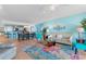 Bright living room with hardwood floors, comfy seating, and a view into the kitchen at 2151 Bridgeview Ct. # 3501, North Myrtle Beach, SC 29582