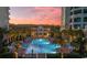 Resort-style pool at sunset with surrounding lounge chairs at 122 Vista Del Mar Ln. # 2-302, Myrtle Beach, SC 29572