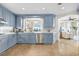 Modern kitchen with light blue cabinets, quartz countertops, and ocean view at 122 Vista Del Mar Ln. # 2-302, Myrtle Beach, SC 29572