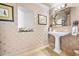 Elegant powder room with pedestal sink and decorative wall at 122 Vista Del Mar Ln. # 2-302, Myrtle Beach, SC 29572