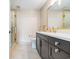 Modern bathroom with a walk-in shower, dark vanity, and gold fixtures at 122 Vista Del Mar Ln. # 2-302, Myrtle Beach, SC 29572
