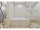 Spa-like bathroom featuring a soaking tub, walk-in shower, and tiled walls at 122 Vista Del Mar Ln. # 2-302, Myrtle Beach, SC 29572