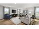 Living room with sectional sofa, accent chair and wood floors at 1068 Oak Meadow Dr., Conway, SC 29526