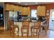 Modern kitchen with stainless steel appliances and wood cabinets at 1409 Arbor Rd., Loris, SC 29569