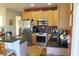 Well-equipped kitchen featuring stainless steel appliances and dark countertops at 1409 Arbor Rd., Loris, SC 29569