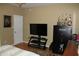 Comfortable bedroom with TV, gun safe, and trophy case at 1409 Arbor Rd., Loris, SC 29569