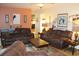 Gathering room with two brown leather sofas and western-themed decor at 1409 Arbor Rd., Loris, SC 29569