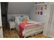 Cozy bedroom with a white bed frame, light walls, and hardwood floors at 1409 Arbor Rd., Loris, SC 29569