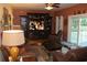 Relaxing Gathering room with leather sofas, large TV, and access to backyard patio at 1409 Arbor Rd., Loris, SC 29569