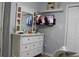 Bright bedroom featuring a white dresser and wall-mounted TV at 1409 Arbor Rd., Loris, SC 29569