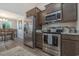 Modern kitchen with stainless steel appliances and ample counter space at 615 Snowy Owl Way, Conway, SC 29527