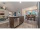 Open concept kitchen with island and stainless steel appliances at 615 Snowy Owl Way, Conway, SC 29527