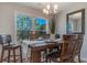 Charming dining area with table and chairs, overlooking a backyard view at 615 Snowy Owl Way, Conway, SC 29527