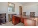 Spacious home office with large desk and built-in shelving at 615 Snowy Owl Way, Conway, SC 29527