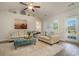 Bright living room with comfy seating and a view to the backyard at 615 Snowy Owl Way, Conway, SC 29527