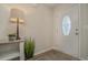 Bright entryway with decorative table, lamp, and plant at 615 Snowy Owl Way, Conway, SC 29527