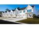 Exterior view of charming townhouses with white siding and green accents at 8926 Brynlee Rd. # 4A, Longs, SC 29568
