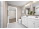 Bathroom with double vanity, neutral tones, and a large walk-in closet at 8926 Brynlee Rd. # 4A, Longs, SC 29568