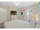 Bedroom with a queen bed, dresser, and ensuite bathroom at 6001-5137 S Kings Hwy., Myrtle Beach, SC 29575