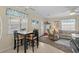 Small dining area with table and chairs, adjacent to living room at 6001-5137 S Kings Hwy., Myrtle Beach, SC 29575