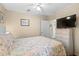 Bedroom with a queen bed, dresser, and ceiling fan at 6001-5137 S Kings Hwy., Myrtle Beach, SC 29575
