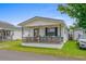 Cute cottage with front porch and string lights at 6001-5137 S Kings Hwy., Myrtle Beach, SC 29575